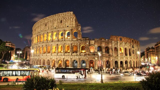 Time-lapse video of Rome's majestic Colosseum, amber lit against indigo night, with vibrant long exposure traffic light trails on wet asphalt. Historical urban pulse.