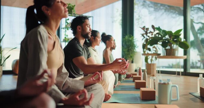 Yoga class, meditation and man with breathwork in studio, relaxation and mindfulness in zen practice. Wellness, mind body connection and calm people at retreat with mudra, thinking and awareness.