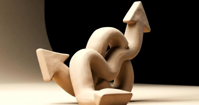 Twisted clay arrows symbolizing growth and direction
