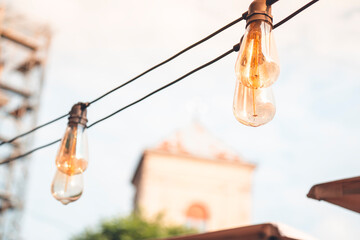 Stylish light bulbs in a cafe hanging on a wire
