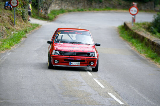 Classic Ford Escort MK2 sports car competing in Rally Villa de Mieres on a mountain road in Asturias Spain August 2 2025 