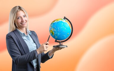 School concept. Woman teacher holds globe.