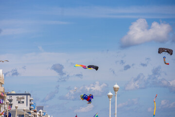 Colorful kites flying in the sky at the Ocean City Boardwalk in Ocean City Maryland USA