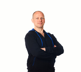 Confident fitness coach posing with folded arms wearing zip up blue hoodie