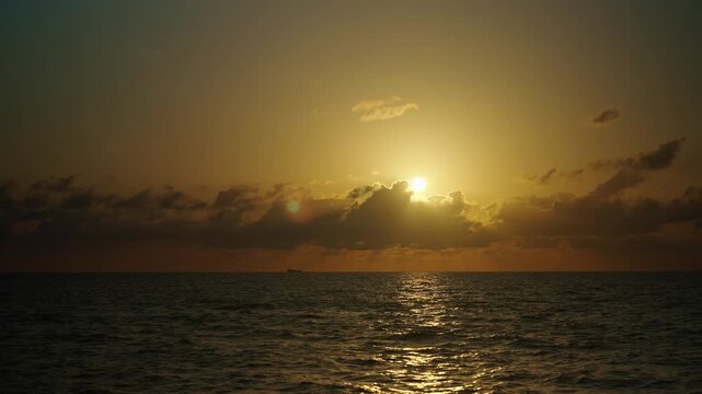 Sunrise seascape. Romantic summer vacation seascape. Sea sunset horizon. Sunset cloudy sky. Seascape at summer vacation. Skyscape with sea horizon. Horizon sunrise sea with ship. 4k footage