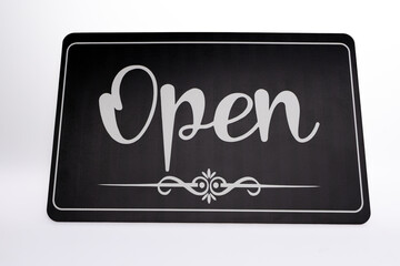 Sign OPEN in bold black and white letters.