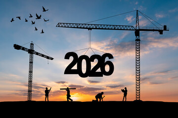 Silhouette of construction crane lifting number 5 to change year 2025 into 2026 at sunset sky,...