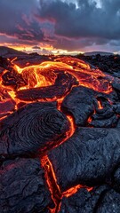 Molten lava flows across dark volcanic rock under a dramatic sunset sky