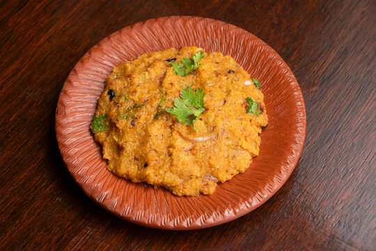 Dal Bhorta topped with coriander on Rustic Plate side view of bangladeshi food