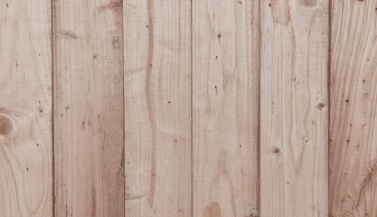 Naklejka premium Wooden fence with light brown vertical planks. Suitable for background elements, texture patterns, rustic or outdoor aesthetic designs.