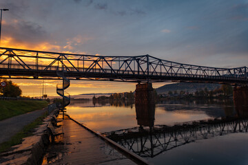 Fototapeta premium bridge over the river at sunset