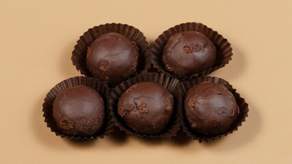 Chocolate balls in paper top view