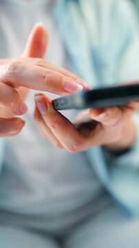 Woman scrolling through social media feeds on smartphone close up