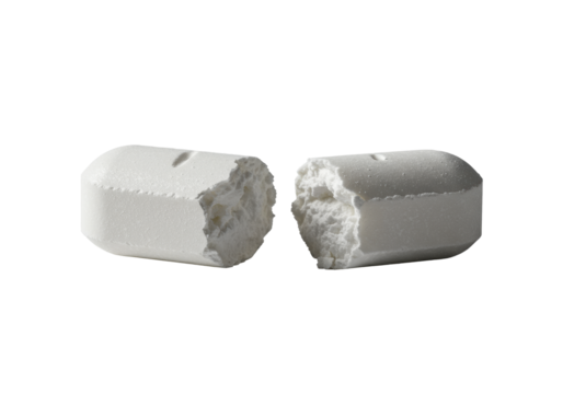 transparent medical tablet, pharmaceutical pill snapped in half, revealing smooth interior, delicate powder dust, on transparent background with soft shadow, extreme macro, low eye-level angle,