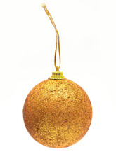 Golden glitter Christmas ball ornament hanging on a string, isolated on a white background. Classic festive decoration.