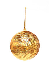 Golden sequin Christmas bauble hanging on a string, isolated on a clean white background. Sparkly holiday decoration.