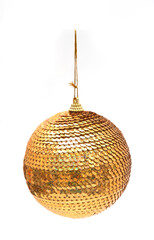 Golden sequin Christmas bauble hanging on a string, isolated on a clean white background. Sparkly holiday decoration.