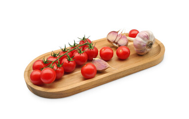 Cherry tomato branch with garlic on wooden tray isolated on white background. Red fresh tomatoes close-up.