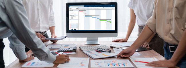 Project planning software for brisk business project management on the computer screen showing...