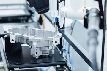 Precision cnc coordinate measuring machine analyzing engine part in high-tech manufacturing conveyor