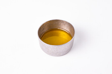 Olive oil in small metal bowl