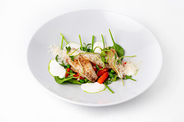 Grilled fish fillets with spinach carrots and peas