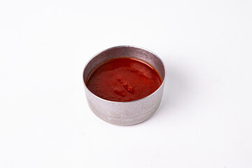 Red sauce in bowl, food condiment ingredient