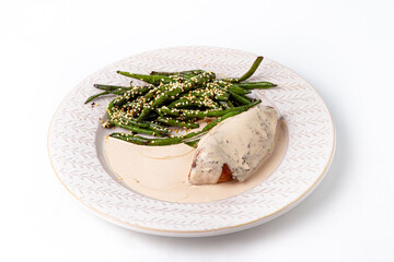Chicken breast serving with green beans and sesame
