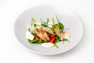 Cooked fish fillet with vegetables and grated cheese