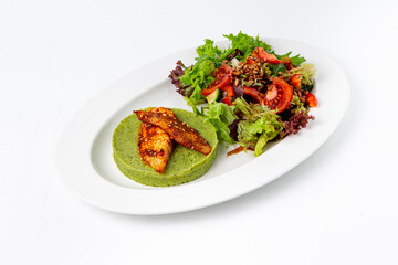 Grilled chicken fillet with pea puree and fresh salad