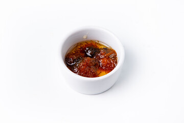 Pine cone jam in white ceramic ramekin