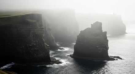 Dramatic misty cliffs meet the wild Atlantic Ocean, creating a powerful landscape image, perfect for travel and adventure campaigns in Ireland