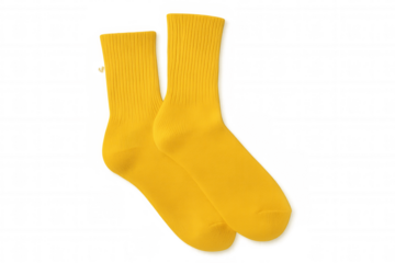 Pair of bright yellow cotton athletic socks for sports and fashion, hosiery apparel accessory on transparent background