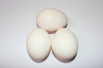 Three eggs on a white background