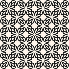 Vector seamless pattern in ethnic folk style. Simple floral geometric ornament texture with star shapes, lattice, grid. Black and white background. Bold design for textile, wallpaper, decor, print