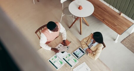 Handshake, above and business people with agreement, partnership and collaboration for financial growth. Analyst, shaking hands and meeting for deal in cafe, company info and data records for trust. - Powered by Adobe