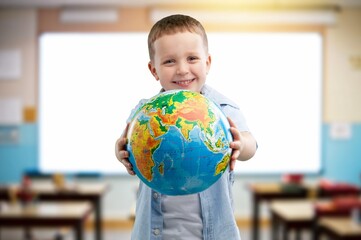 Happy child school student in classroom for learning