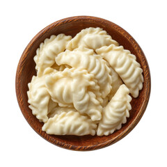 Delicious homemade pierogi in a wooden bowl against black backdrop