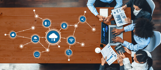 Panorama top view multiracial analyst team use BI dashboard display on laptop screen, analyzing financial data for strategic decision. Fintech analyzes marketing indicators. Concord Amity