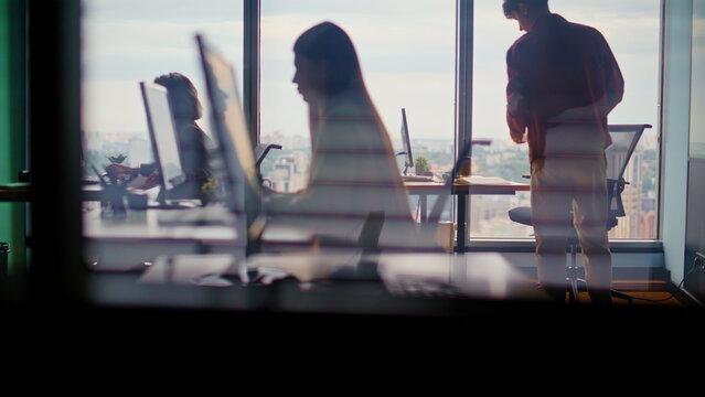 Corporate workers silhouettes typing computers in studio. People debugging code