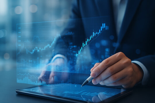 Financial analyst using tablet technology to review global stock market data trends and economic business growth