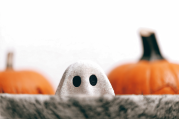 Halloween ghost decoration with pumpkins a spooky and festive scene perfect for holiday themes