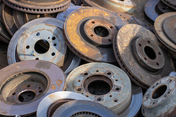 pile of vehicle roters brakes rusty wheels