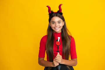 Teen girl with pumpkin. Halloween witch girl. Teen witch. Kid girl witch celebrates Halloween. Happy Halloween. Portrait of an Halloween child teenager girl. Seasonal autumn sale.