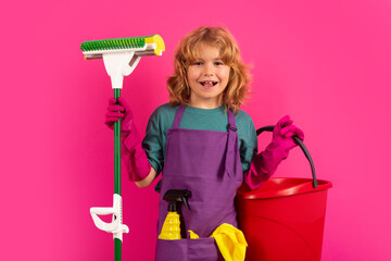Studio portrait of child helping with housework, cleaning the house. Housekeeping, home chores.
