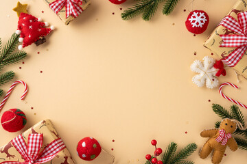 Colorful Christmas setup with wrapped gift, candy canes, pine branch, ornament, and gingerbread...