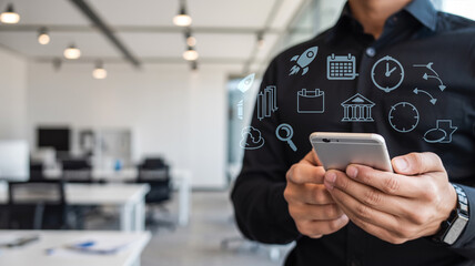 Man in black shirt using smartphone with overlaid business icons in a modern office setting view