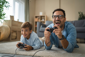 Father and son playing video games bonding at home