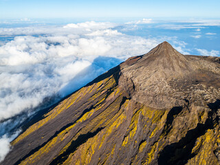 Top of Mount Pico Stratovolcano, Crater and Clouds. Shadow of Mountain. Atlantic Ocean. Pico Island, Azores. Portugal. Aerial View