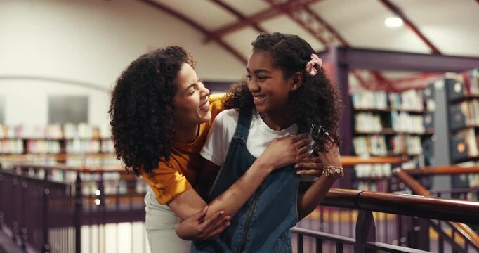 Face, mother and child with hug in library for bonding together, connection and skill development. Smile, parent and daughter with embrace in bookshop for knowledge, learning support or storytelling.
